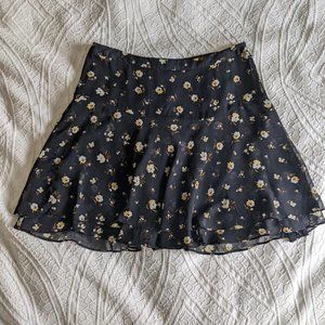 Old Navy Size 6 black flowy mini skirt with yellow and white flowers